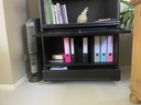 Black bookcase with glass doors and drawers