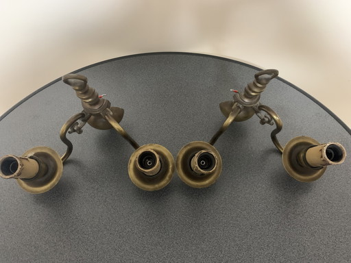 Two two-armed brass wall light