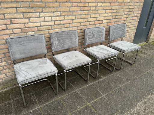 4 sillas de tela acanalada pura con estructura tubular cromada