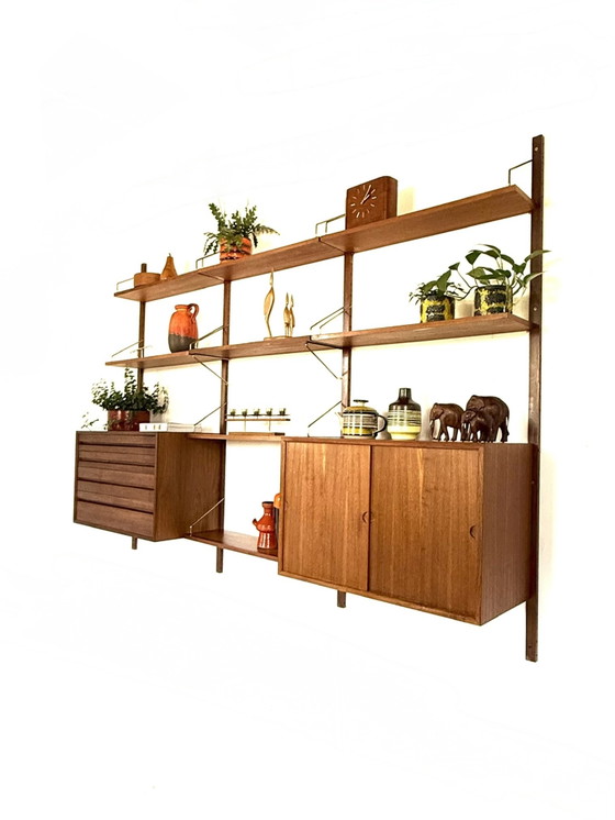 Vintage modulair teakhouten wandsysteem, Poul Cadovius ‘60 – Wandkast, Wood, Brass (photo 14 of 15)