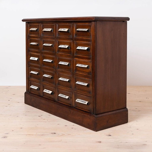 Cassettiera da farmacia, in legno massello di quercia, restaurata, inizio XX secolo.