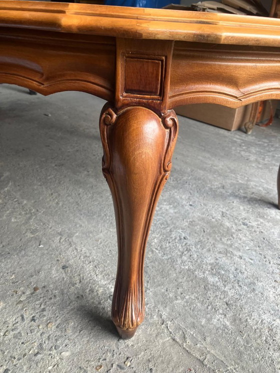 Vintage oval coffee table in French Louis XV style is made of cherry wood and features a glass top over (photo 8 of 8)