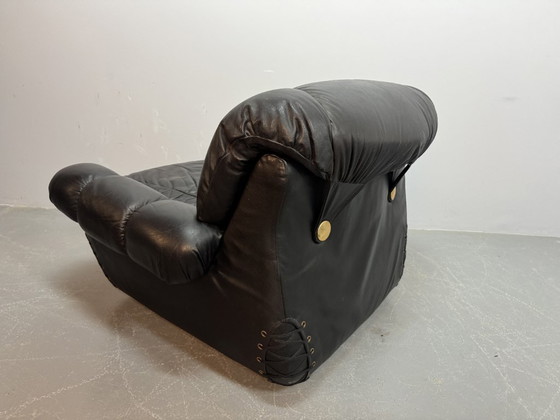 Image 1 of Beautiful Big Black Leather Postmodern Italian Design Space Age Lounge Chair with Brass Buttons and Playful Cord Lacing, 1970s.