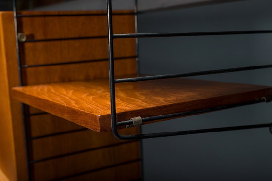 Image 1 of Modulaire wandplank in teak van Nils Strinning voor String, 1960, set van 29