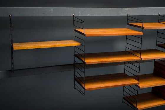 Image 1 of Modulaire wandplank in teak van Nils Strinning voor String, 1960, set van 29