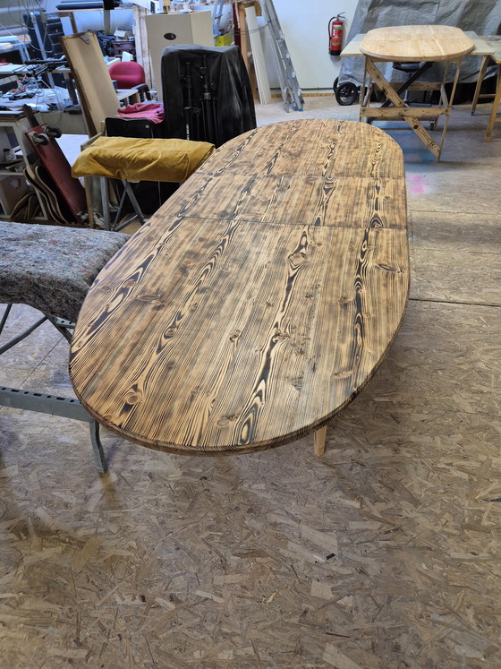 Image 1 of Oval dining table with burnt wood top