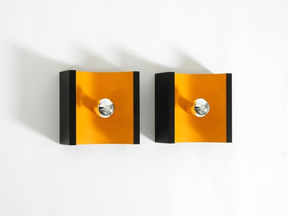 Image 1 of A rare pair of original 1960s Space Age metal wall lamps by Klaus Hempel for Kaiser Leuchten in yellow and black