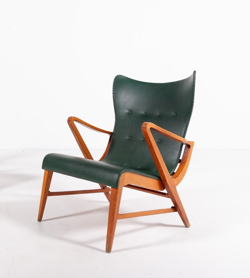 Sillón arquitectónico sueco de estilo moderno de mediados de siglo, diseñado por Axel Larsson en la década de 1950.