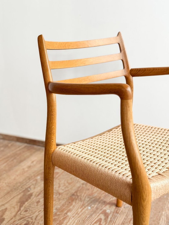 Image 1 of Esszimmerstuhl mit Armlehnen aus Eichenholz, Modell 62 für J.L. Moller