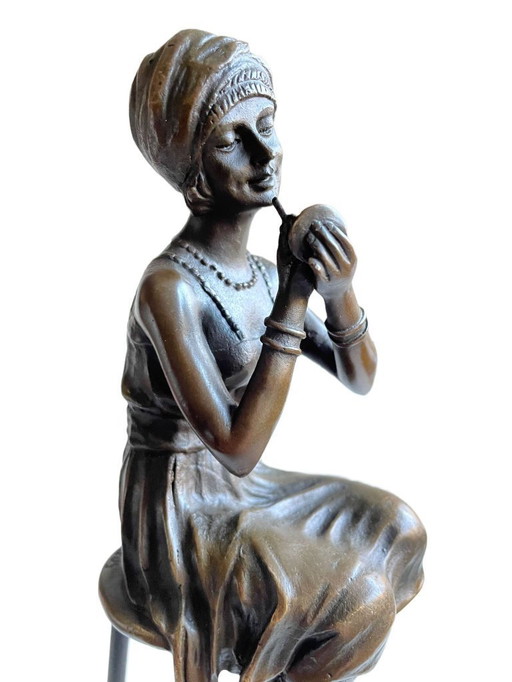 Bronze statue - Elegant lady on stool in Charleston style.