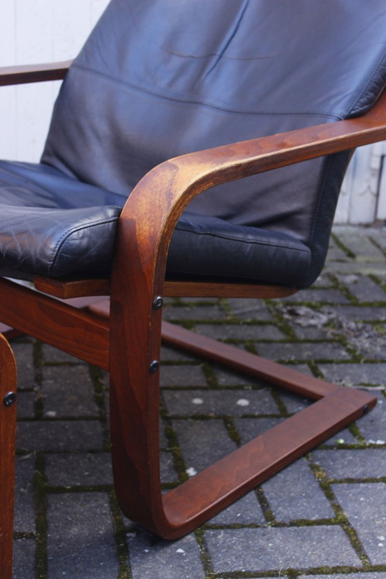 Image 1 of Ikea Vintage - Ikea POÄNG recliner and footstool in black leather, Scandinavian design, 1990s