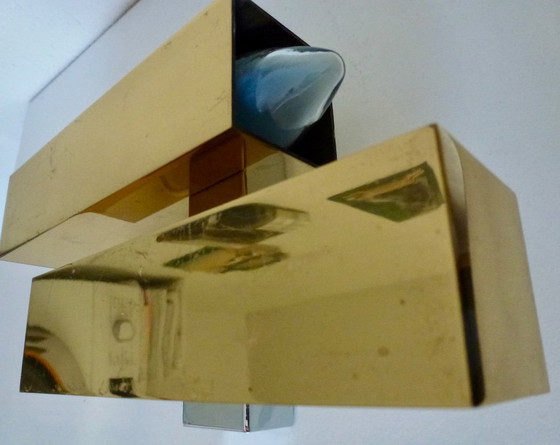 Image 1 of A brass wall lamp, in a minimalist, geometric style, from the middle of the last century.