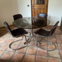 Tavolo Roche Bobois. 1970. Cromo e vetro fumé.