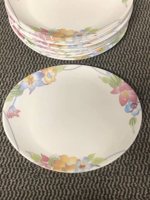 15 plates with multicolored floral designs