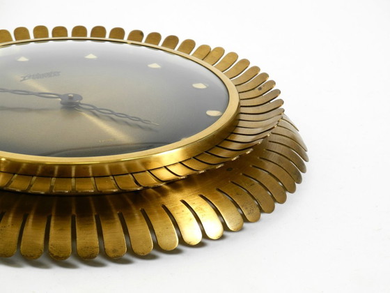 Image 1 of Beautiful original Mid Century Sunburst Atlanta Universe wall clock made of heavy brass with a mechanical seven-day movement