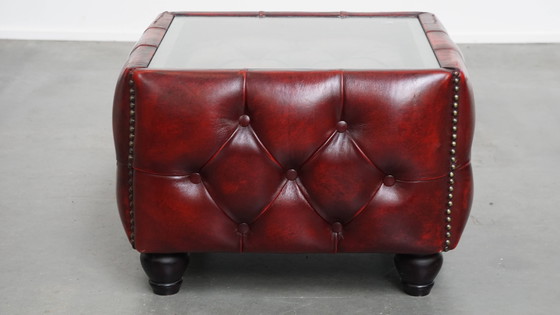 Image 1 of Beef leather chesterfield side/ coffee table in a red color with glass top