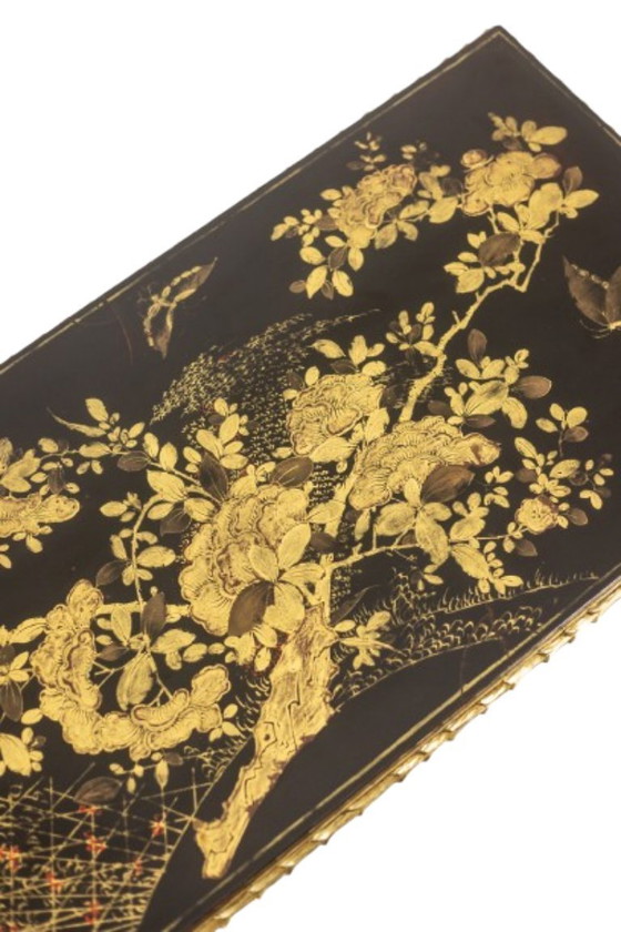 Image 1 of Maison Baguès. Mesa de centro en bronce, laca negra y detalles dorados. Hacia 1970.