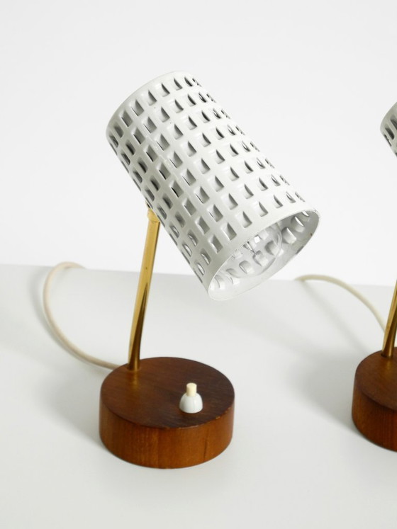 Image 1 of A pair of beautiful mid-century modern bedside lamps with perforated metal shades and teak wood bases