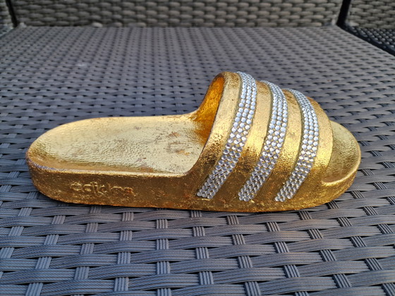 Image 1 of La pantoufle d'or / Bling