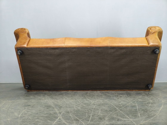 Image 1 of Arcon Italia driezitsbank uit de jaren 70, bekleed met cognacbruin buffelleer.