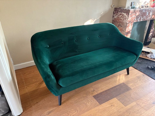 Groen fluwelen bank