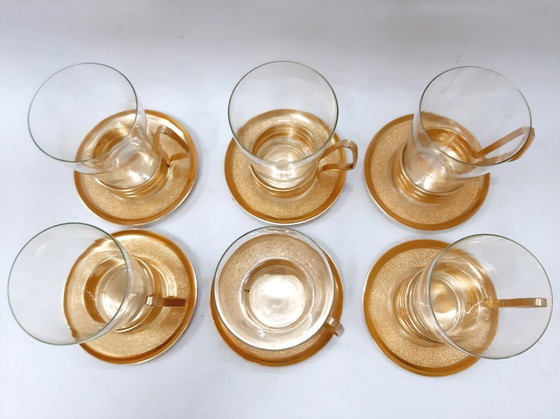 Image 1 of Set di 6 tazze in vetro con portabicchieri in rame/ottone con piattini
