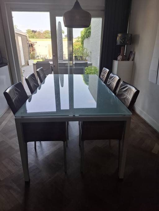 Sturdy dining table with glass top