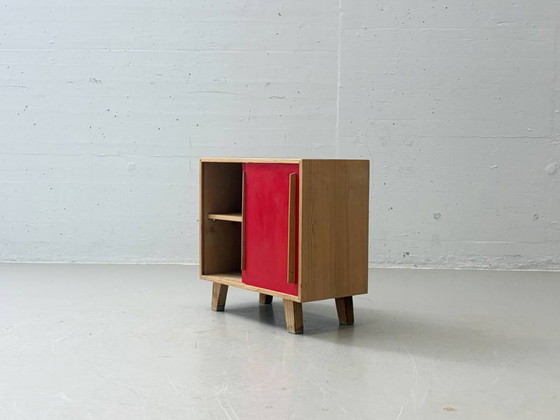Image 1 of Stella Furniture ladekast met rode schuifdeuren, jaren 90