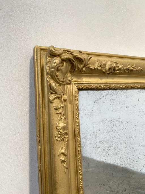Stuccoed and gilded wooden mirror, 110cm high, 19th century, France