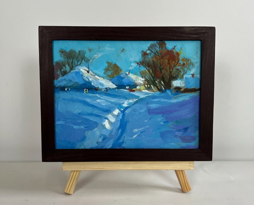 Origineel olieverfschilderij: Winterdorplandschap met een pad door de sneeuw.
