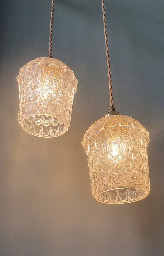 Image 1 of Set of two vintage Mic Century pendant lamps of thick, textured glass.