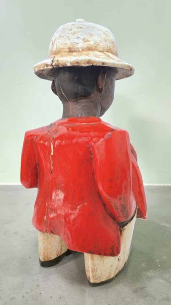 Image 1 of Afrikaner mit dickem Bauch und tropischem Helm