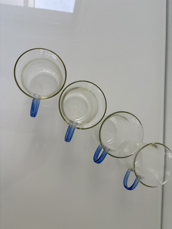 Image 1 of Set of four glass tea mugs with colored handles