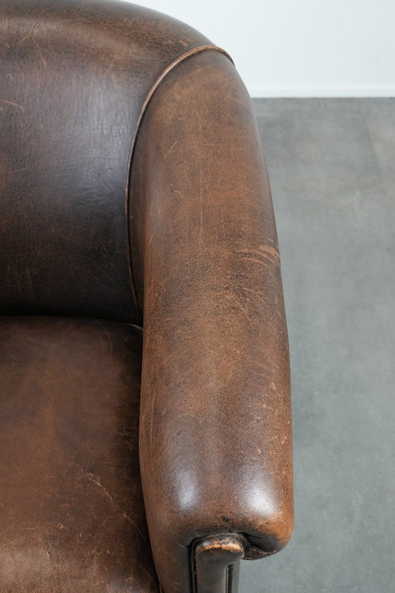 Image 1 of Sturdy and characterful vintage sheepskin club armchair