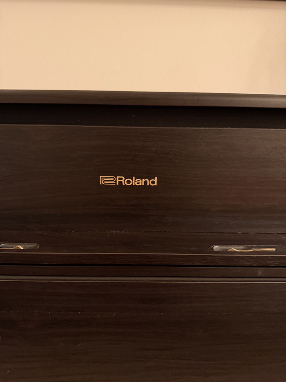 Image 1 of Uitstekende Roland XL705-DR piano - palissanderhout