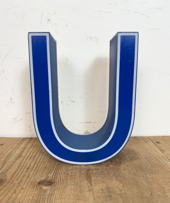 Image 1 of Industrial dark blue enamel factory pendant light made in United Kingdom during the 1950s. White enamel inside the shade. Brass 