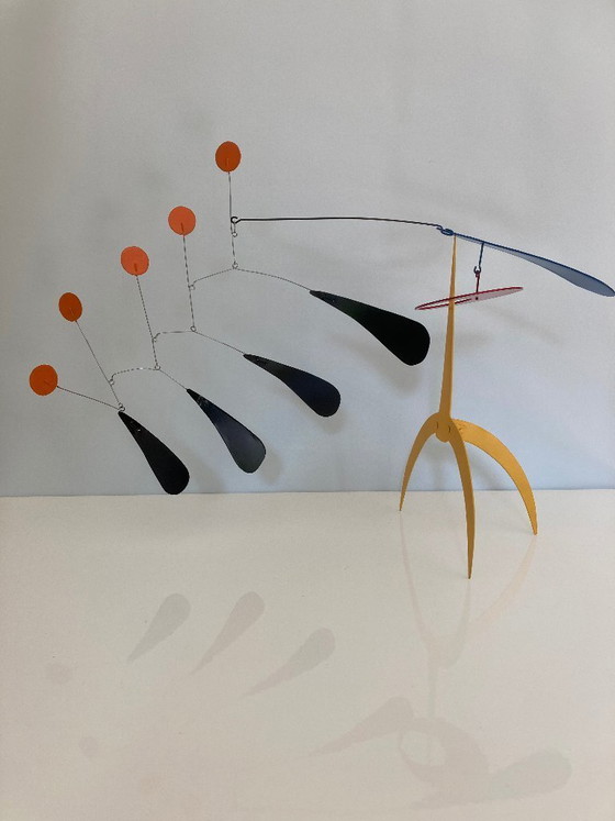 Image 1 of Yellow standing mobile with 5 orange discs