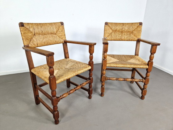 Image 1 of Vintage Franse Armleuningstoelen | Eiken en Riet