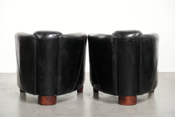 Image 1 of 2x rugged black vintage cowhide Aviator design armchairs with a distinctive look