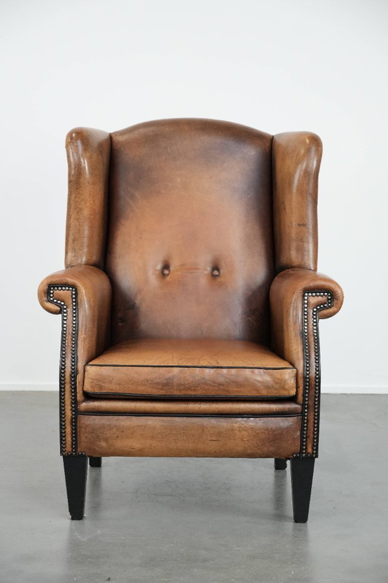Image 1 of Sheepskin wing chair with a characterful appearance
