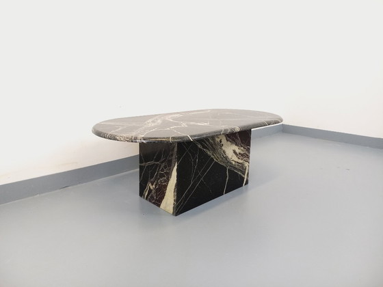 Image 1 of Vintage oval coffee table in black marble from the 1970s