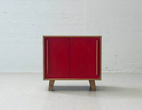 Image 1 of Stella Furniture ladekast met rode schuifdeuren, jaren 90