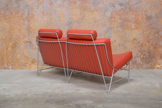 Image 1 of Red leather Leolux Volare design two-seater sofa