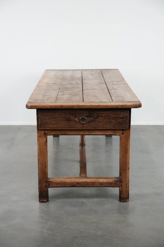 Image 1 of Robust antique French 6-person dining table made of fruit wood with 3 drawers from the late 18th century
