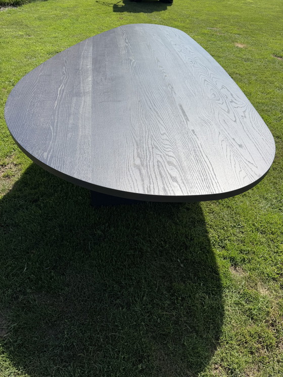 Image 1 of Teardrop-shaped table