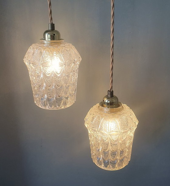 Image 1 of Set of two vintage Mic Century pendant lamps of thick, textured glass.