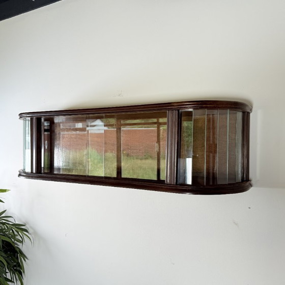 Image 1 of Subtle hanging display case with polished slats