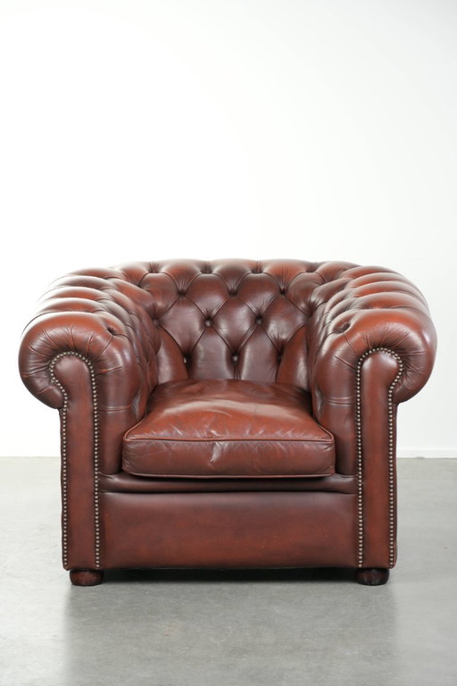 Beautiful red/brown cowhide Chesterfield armchair in a classic English style