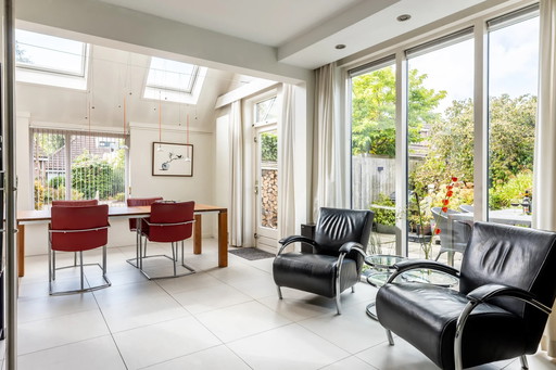 Two Molinari armchairs, Accademia model, black leather