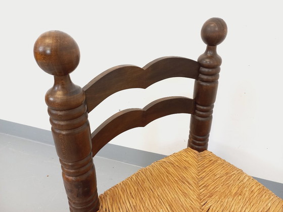 Image 1 of Vintage Charles Dudouyt Brutalist lage stoel in hout en stro uit de jaren 40